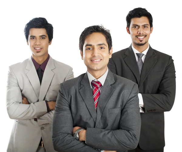 Retrato de tres hombres de negocios de pie con los brazos cruzados y sonriendo — Foto de Stock