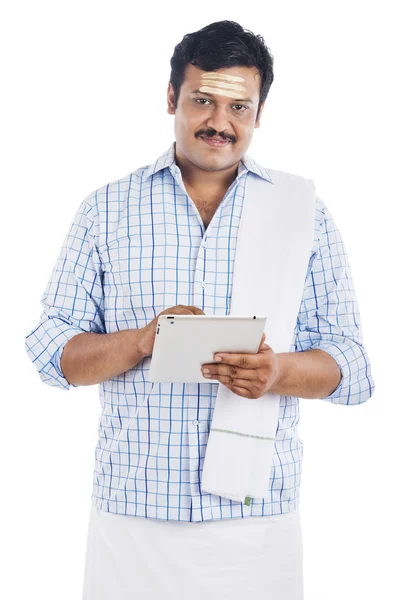 South Indian man using a digital tablet — Stock Photo, Image