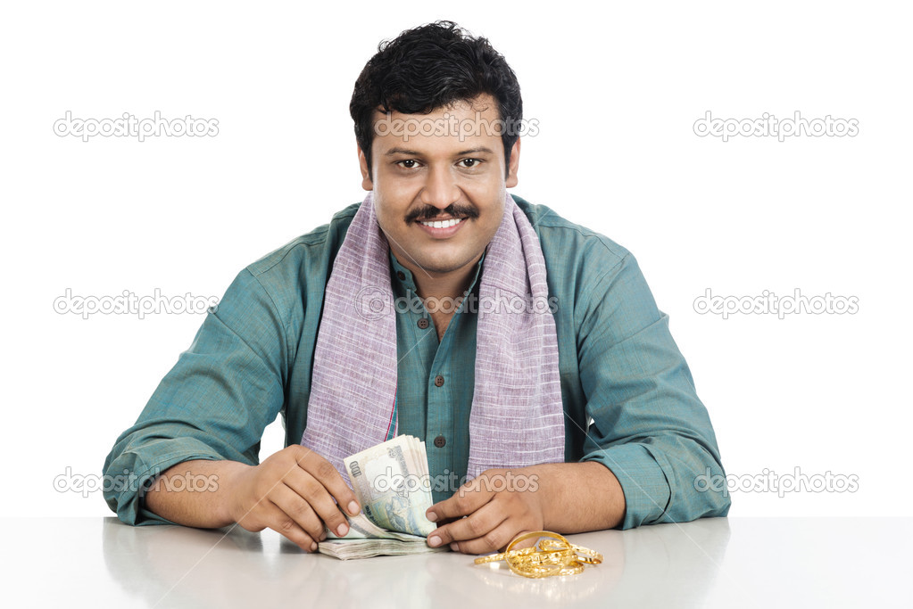 Portrait of a man counting money and smiling