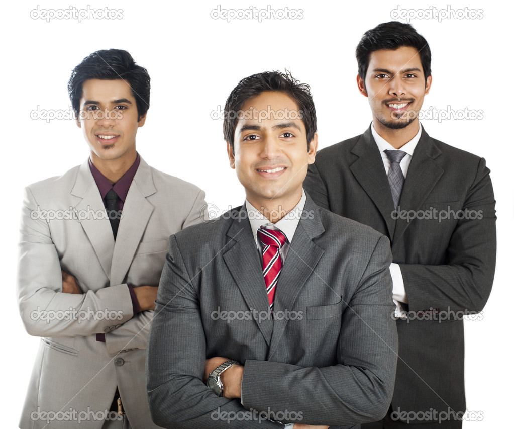 Portrait of three businessmen standing with their arms crossed and smiling