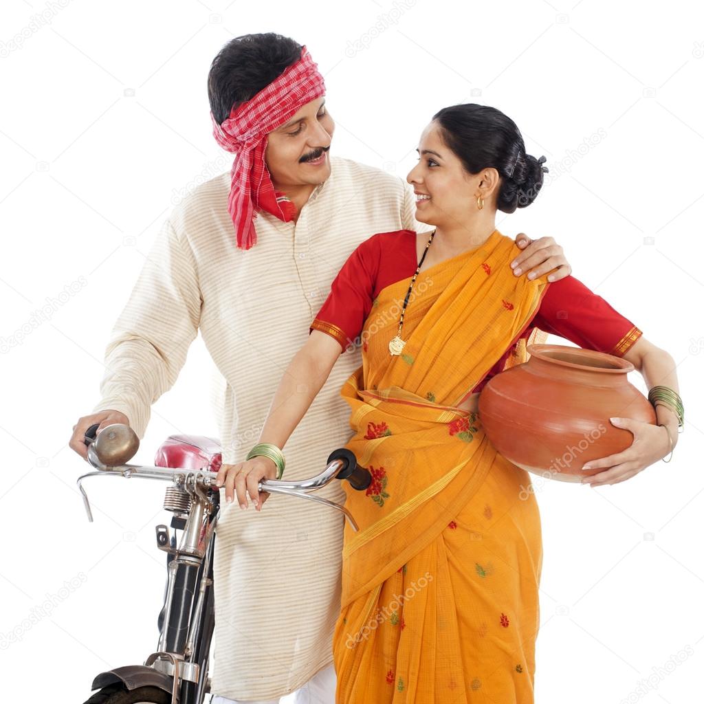 Close-up of a couple with bicycle