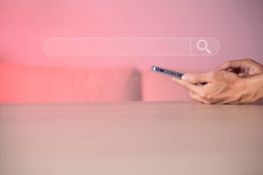 Search technology, search engine optimization, man's hand using smartphone to search information, using search bar function on your website. SEO.
