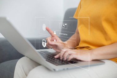 Person using laptop and touching virtual screen for two-factor authentication for safety use of social networks and access to information privacy