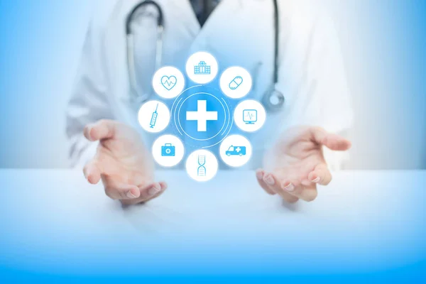 Doctor showing medical icons. Medical technology icons virtual screen. Health care and medical technology services concept.