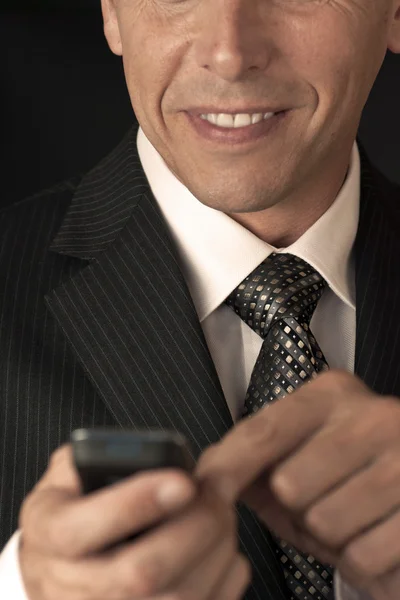 Businessman Texting With A Smile — Stock Photo, Image