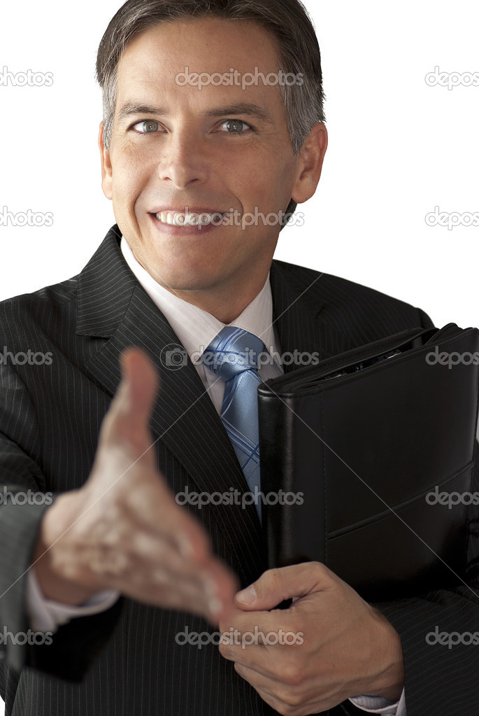 Smiling Businessman Offers Handshake