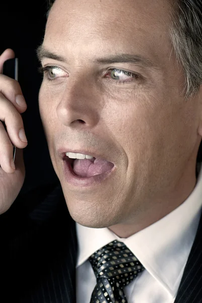 Businessman With Nervous Look To Cell Phone — Stock Photo, Image