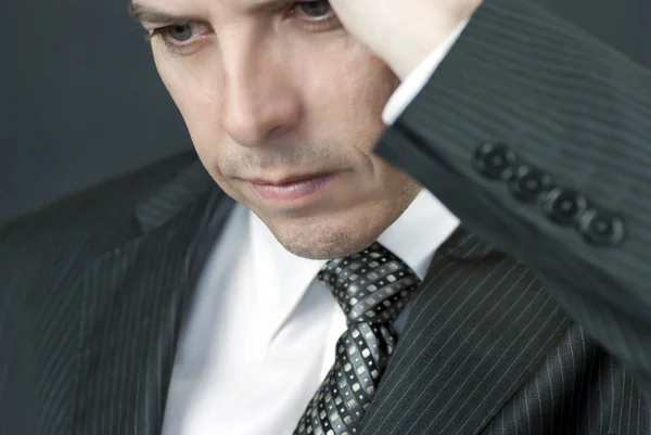 Intense Businessman Looks Down — Stock Photo, Image