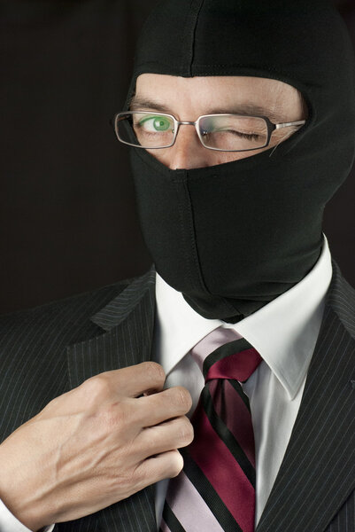 Businessman Wearing Balaclava Winks To Camera