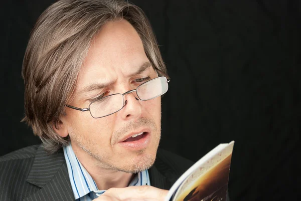 Casual Businessman Wearing Reading Glasses Reading Book — Stock Photo, Image