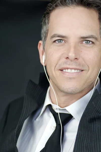 Smiling Businessman Wearing Headphones Looks To Camera — Stock Photo, Image