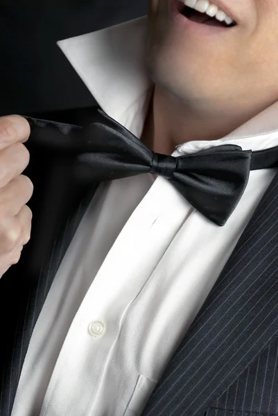 Man Loosens Bowtie — Stock Photo, Image