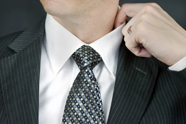 Businessman Adjusts Collar — Stock Photo, Image