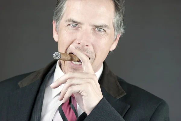 Confident Businessman Smokes Cigar — Stock Photo, Image