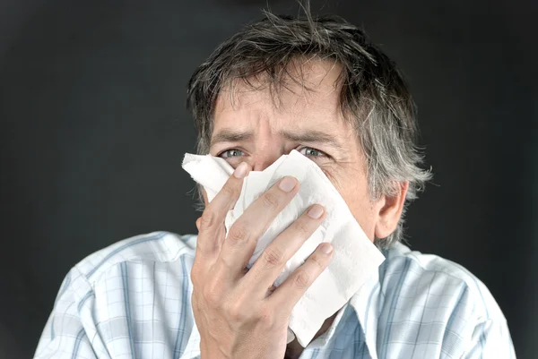 Man Sneezes Into Tissue Front — Stock Photo, Image