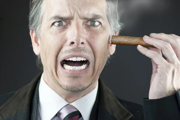 Stressed Businessman Stubs Out Cigar On Face — Stock Photo, Image