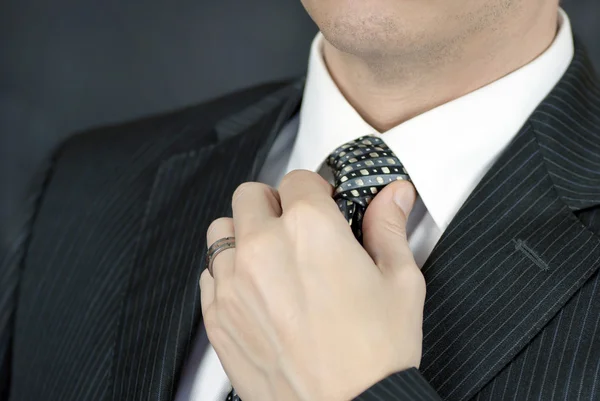 Businessman Adjusts Tie — Stock Photo, Image