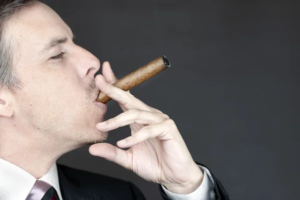 Businessman Smokes Cigar Appreciatively — Stock Photo, Image