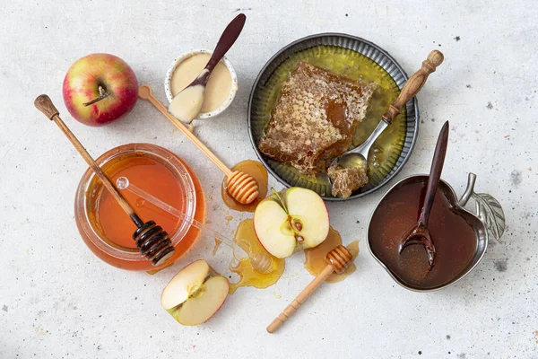 Honey, apple, honey comb , table set with traditional food for Jewish New Year Holiday, Rosh Hashana