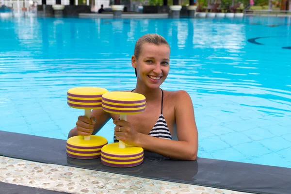 Water aerobics. woman and aqua equipment, dumbbells — Stock Photo, Image