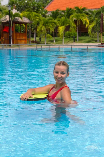 Swimmer during practice with board from polyfoam for swimming — Stock Photo, Image