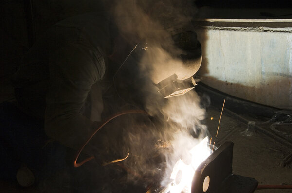 Welder and Tools on Building Site