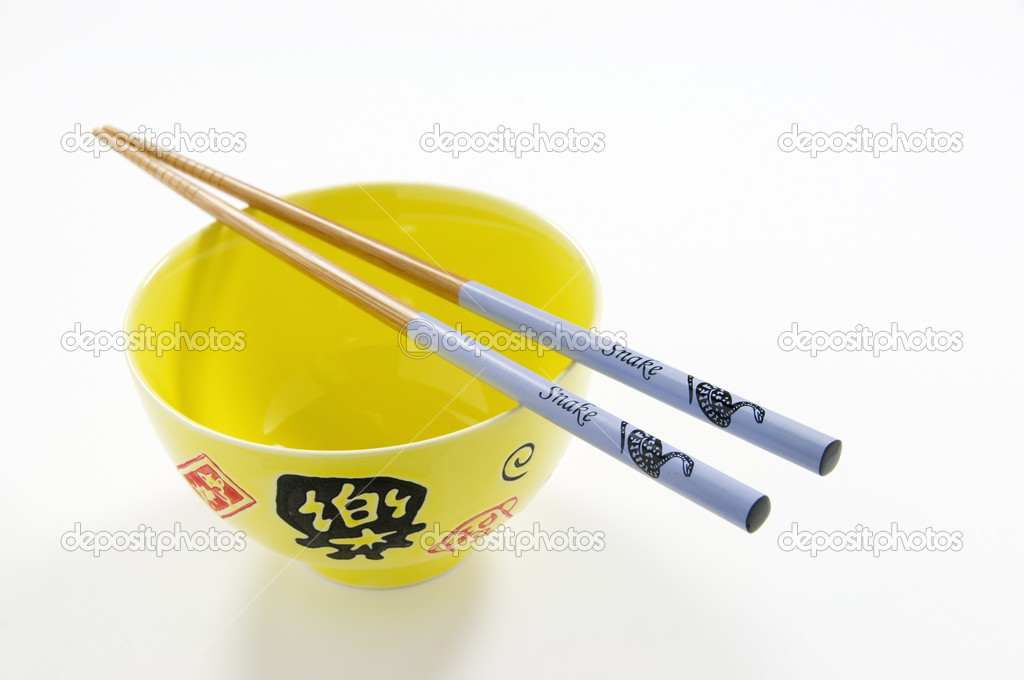 Chinese Rice Bowl and Snake Chopsticks on White Background. Chinese New Year
