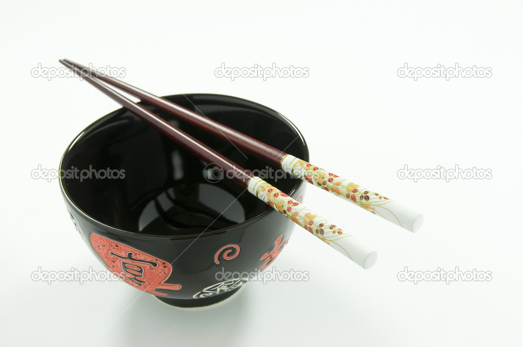 Chinese Rice Bowl and Decorated Chopsticks on White Background