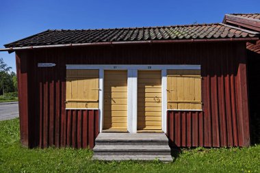 Lovanger, Norrland Sweden - July 31, 2020: old wooden church cottages 