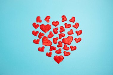 Red hearts on a blue background. Valentine's day concept.