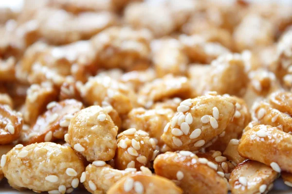 Sweet peanuts with sesame — Stock Photo, Image