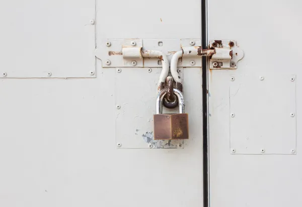 Master key is lock on white steel door — Stock Photo, Image