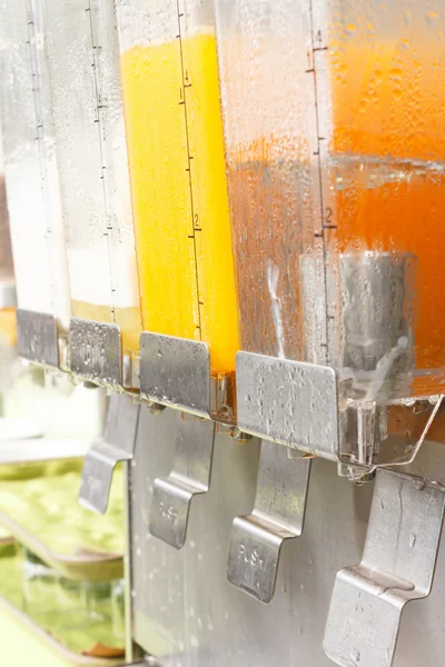 Orange juice in dispenser — Stock Photo, Image