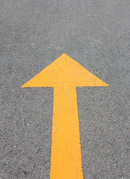Yellow arrow up on asphalt street — Stock Photo, Image