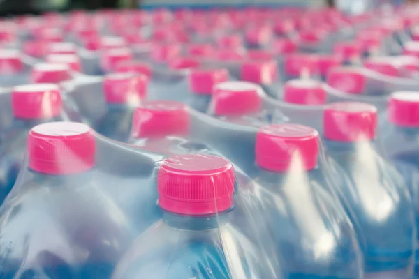 Bottled water bottles in plastic wrap — Stock Photo, Image