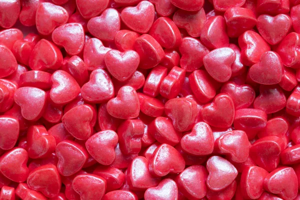 Top View Small Red Hearts Shaped Sugar Sprinkles Background — Foto de Stock