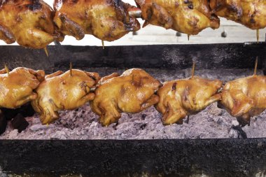 Roasted Whole Chicken on Charcoal Stove. Thai Street Food