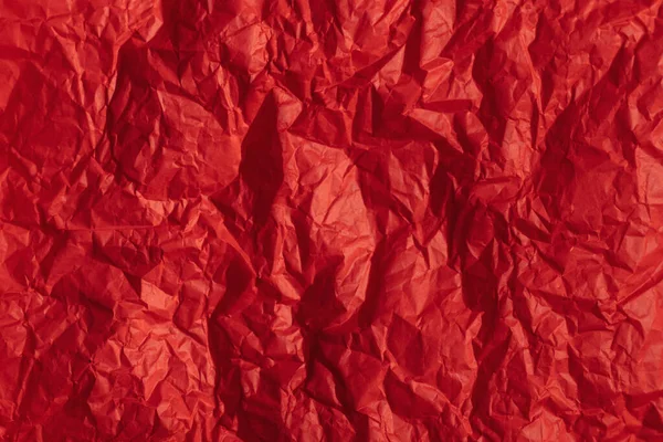 Parlak kırmızı kağıt dokusu veya arka plan. El işi kırmızı kağıt.