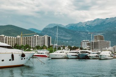 Amazing view of Budva and yacht marina, Montenegro. Beautiful cloudy sky. Travel destination in Montenegro.