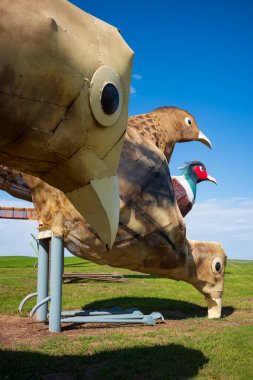 Regent, ND, USA - Jun 19, 2022: Pheasants on the Prairie is 1 of 8 scrap metal sculptures constructed along the 32-mile Enchanted Highway. The collection is considered the world's largest. Artist Gary Greff conceived of the project.