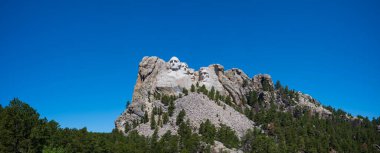 Mount Rushmore National Memorial depicts the U.S. presidents George Washington, Thomas Jefferson, Theodore Roosevelt and Abraham Lincoln are carved into Mount Rushmore in the Black Hills. 