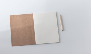 White plain diary or blank journal for writing memo, note and message. Sketchbook or booklet with open page for business, studying, or learning. Notebook mock up design concept for office or lifestyle