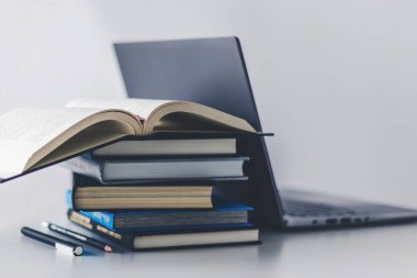Computer laptop with book. Business success idea and education, studying and learning concept. Businessman or student knowledge inspiration and cognition development