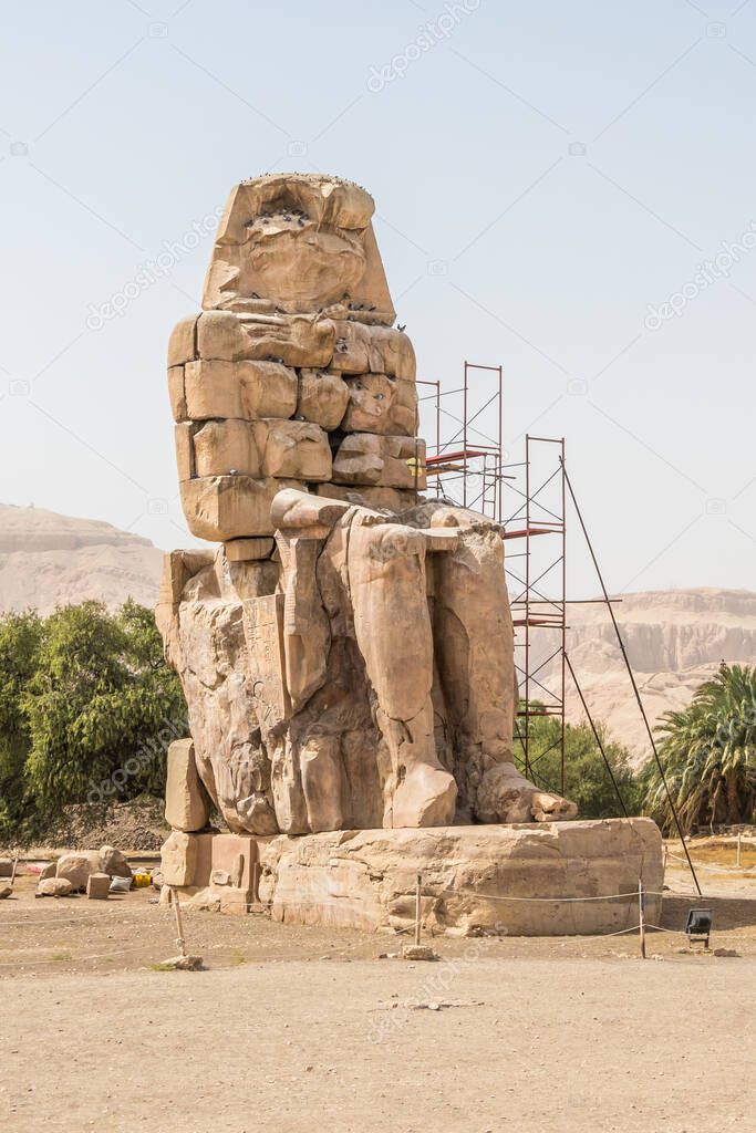 Ancient statue of Colossi of Memnon on the west bank of the Nile, Luxor, Egypt