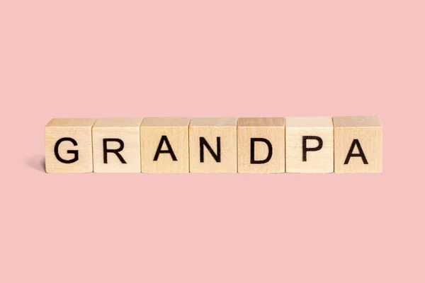 Wooden Cubes Word Grandpa Pastel Pink Background Copy Space — стоковое фото