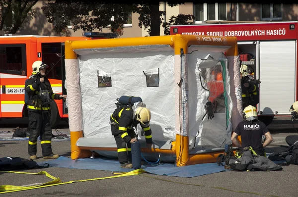 Fire rescue units at antichemical tent — Stock Photo, Image