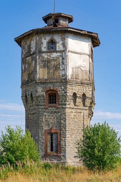 Old Stone Water Tower Windows Wooden Roof Background Blue Sky — Stock Photo, Image