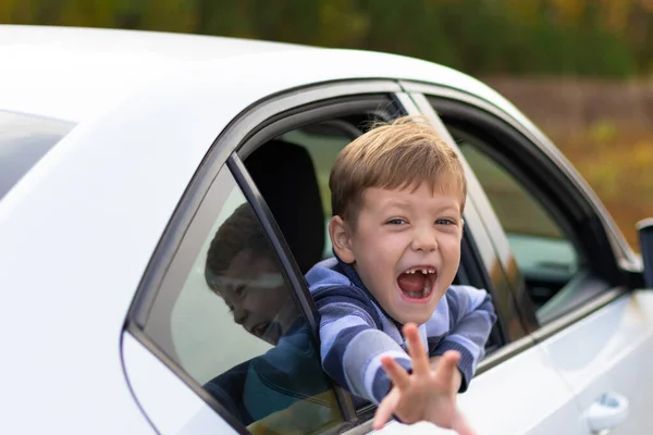 Seven Year Old Cute Boy Leans Out Window White Car — Stock Photo, Image