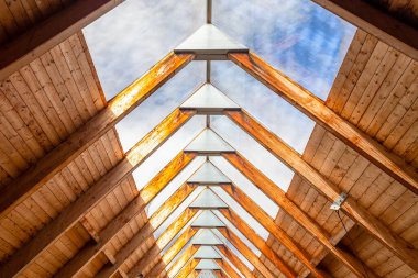 Neratov, Czech republic - 07 13 2022: glass top of the wooden roof of the church of the Assumption of the Virgin Mary, view from the inside