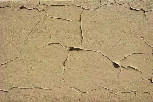 Kırık Duvarların Arkaplanı Bej Tonlarda Soyulmuş Macunla Kaplı Kapatın — Stok fotoğraf
